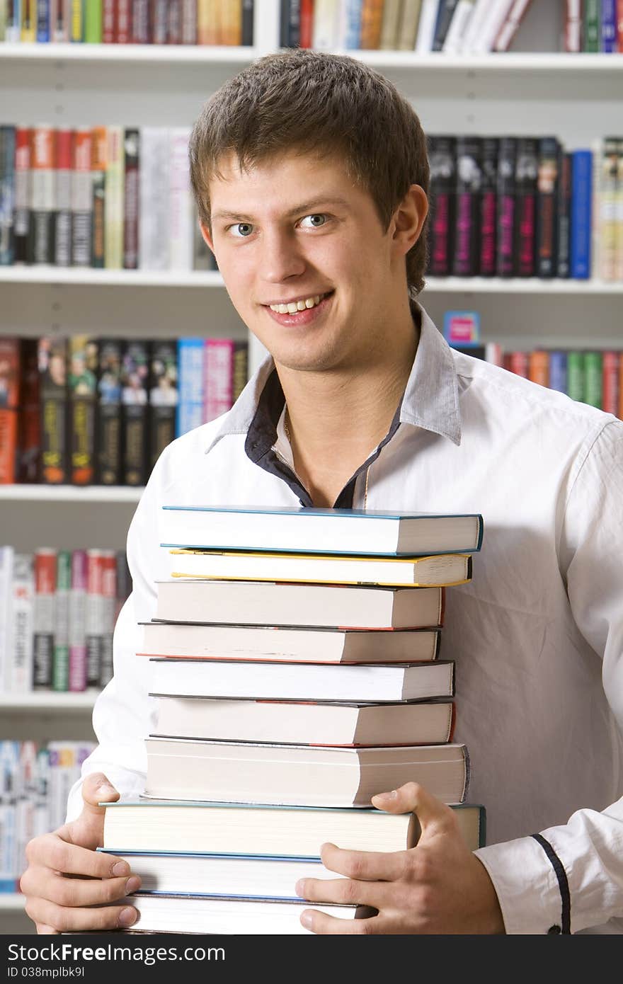 Student sitting with books