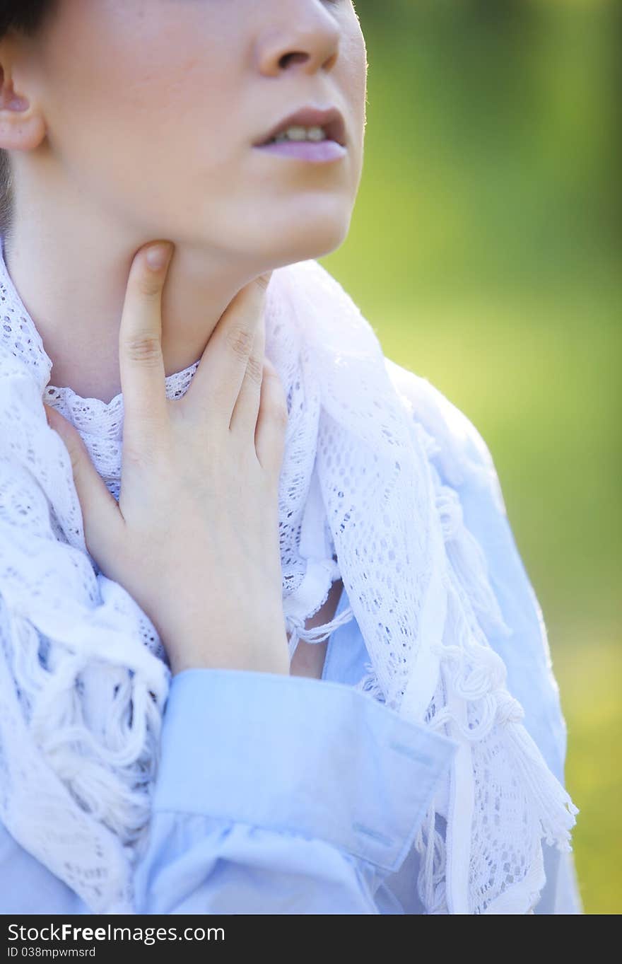 Young woman with a hand of her neck. Young woman with a hand of her neck