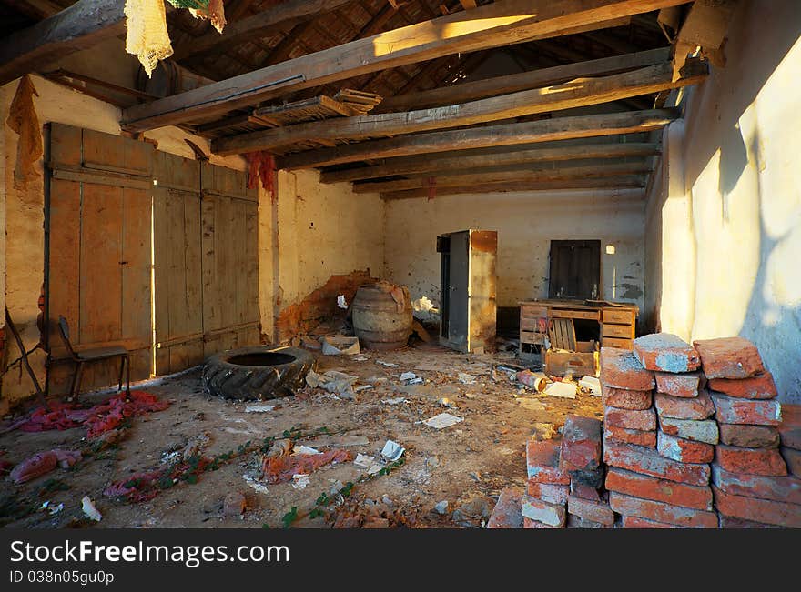 Interior of an old ruined house, old textures and furniture. Interior of an old ruined house, old textures and furniture.