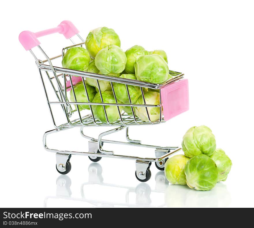 Brussels sprouts in the shopping cart on white