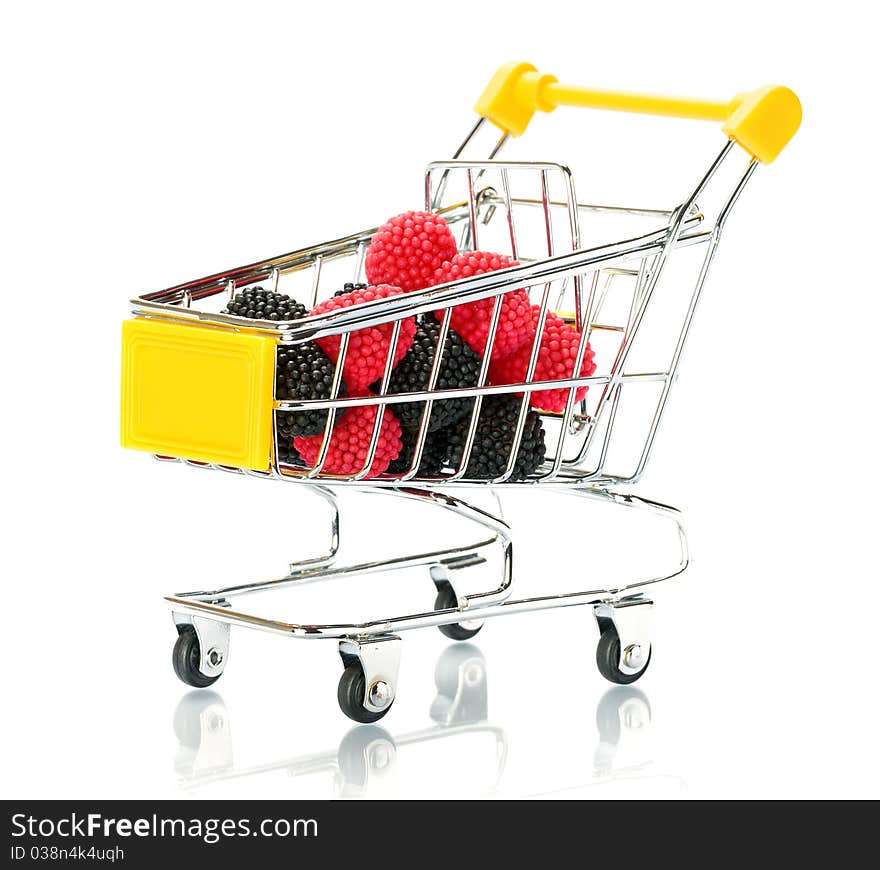 Raspberry blackberry fruit in the shopping cart. Isolated.