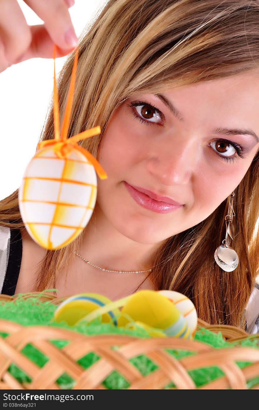 Young beautiful girl with easter egg in her hand