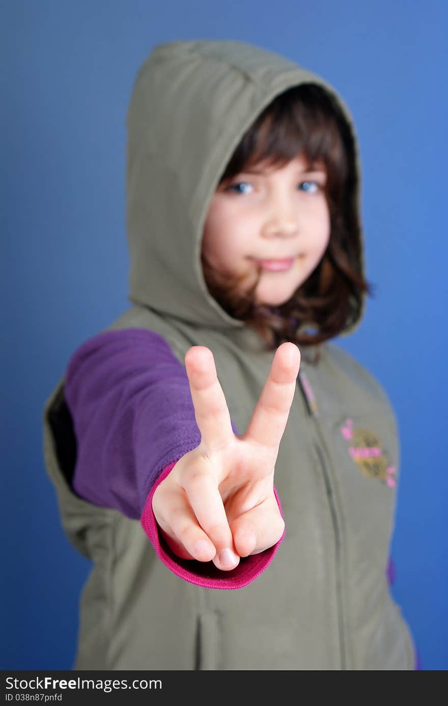 Little child making peace sign