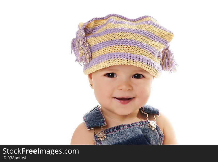 Portrait of cute happy smiling baby girl in funny hat isolated on white background