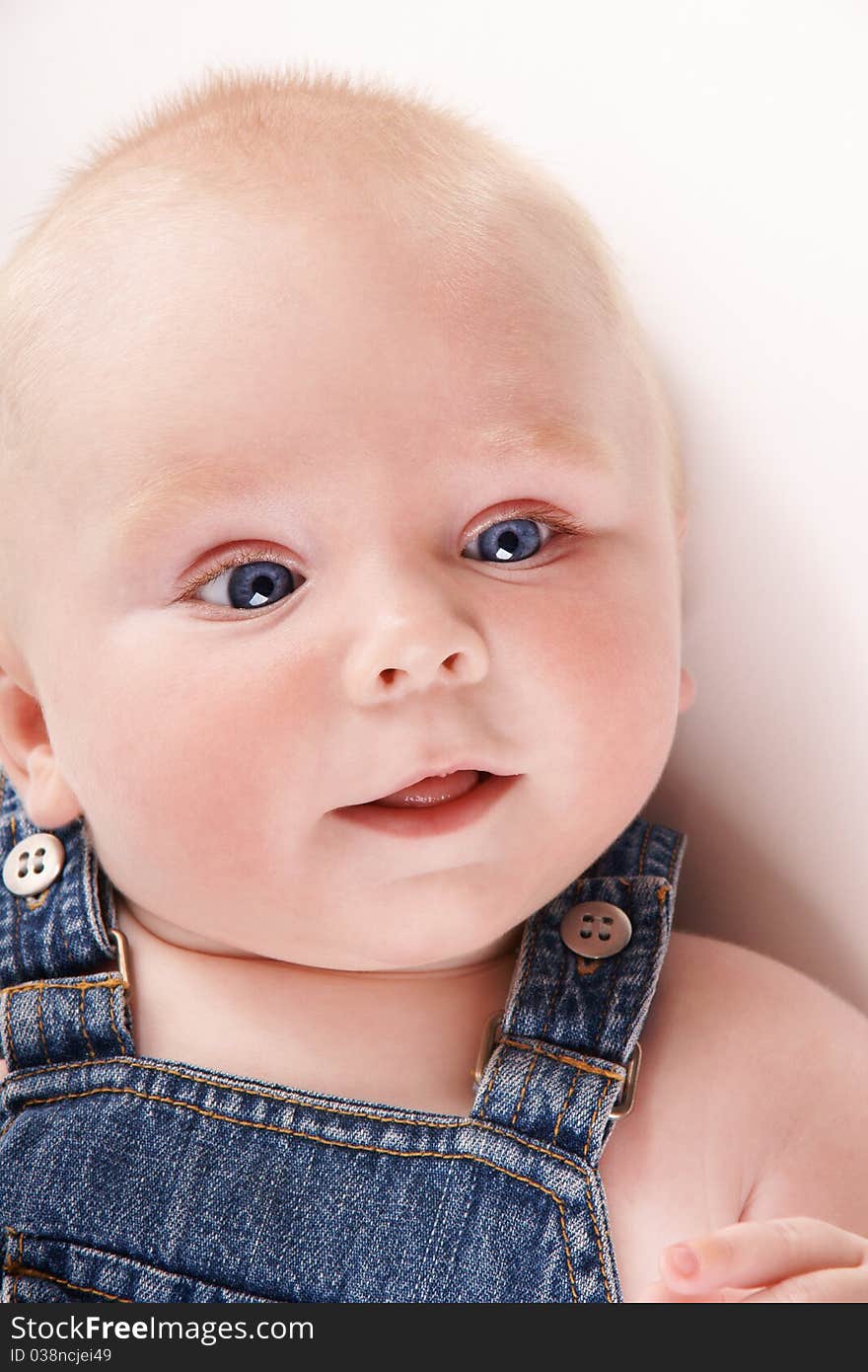 Portrait of cute smiling baby-boy with blue eyes, studio shot. Portrait of cute smiling baby-boy with blue eyes, studio shot