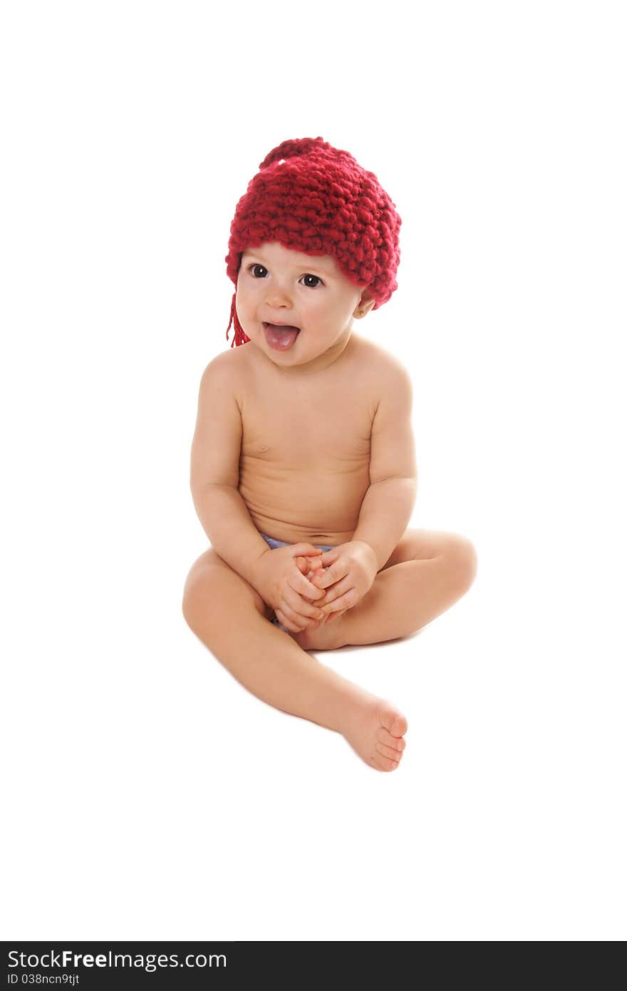 Cuute happy laughing baby girl in funny hat showing tongue on white background. Cuute happy laughing baby girl in funny hat showing tongue on white background