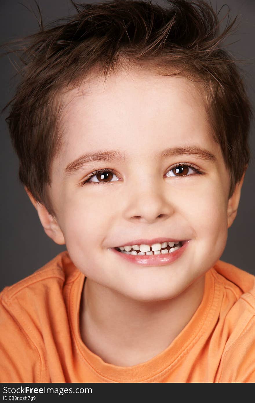 Close-up portrait of joyful smiling beautiful little boy, studio shot. Close-up portrait of joyful smiling beautiful little boy, studio shot