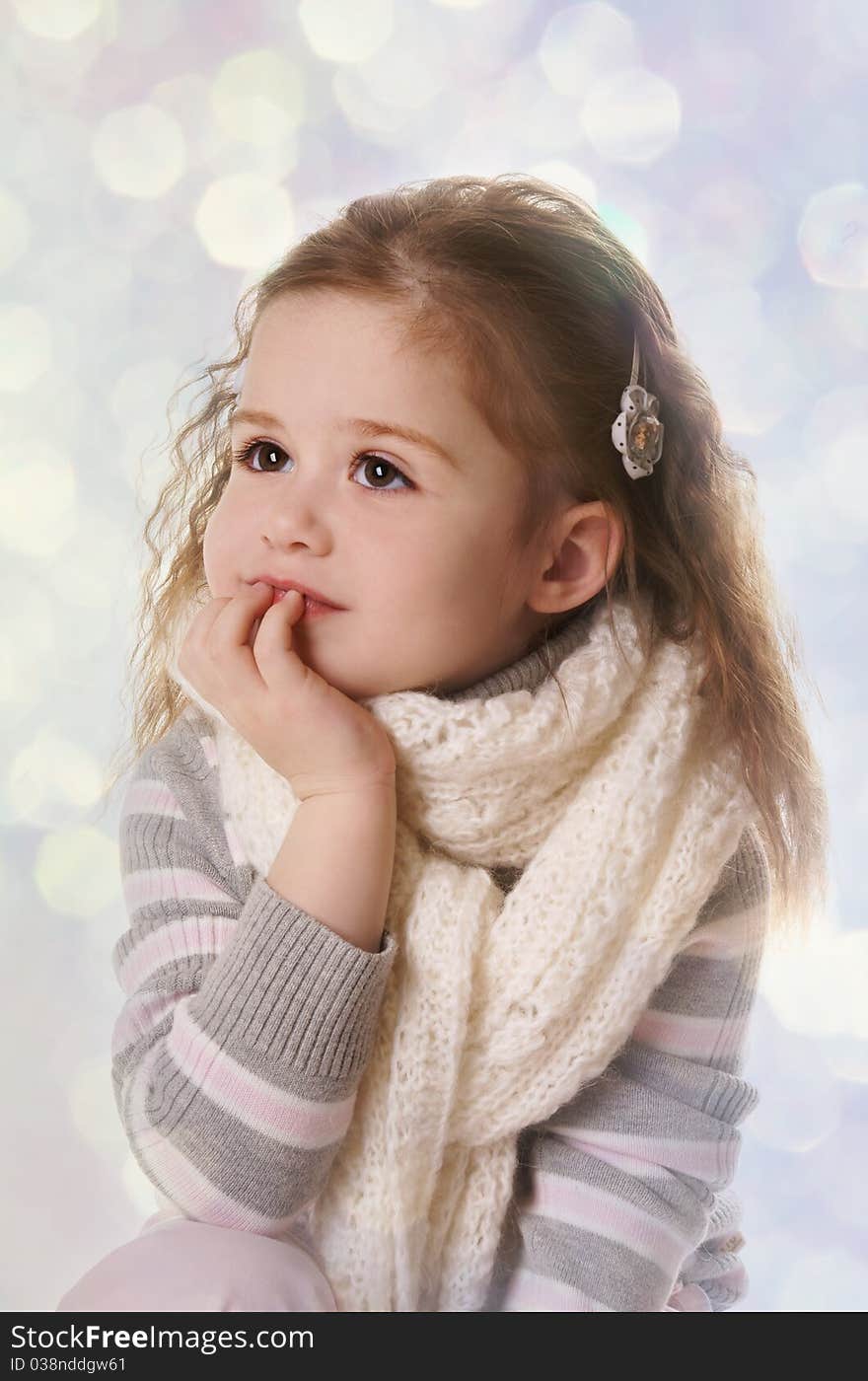 Thoughtful smiling little girl isolated on white background. Thoughtful smiling little girl isolated on white background