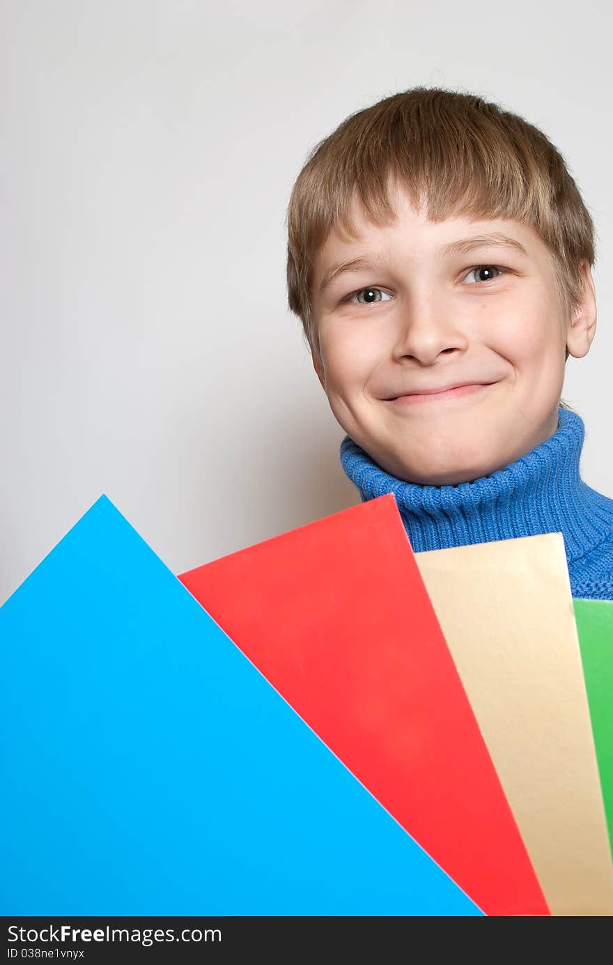 Portrait of a teenager isolated on a white background. Happy youth.