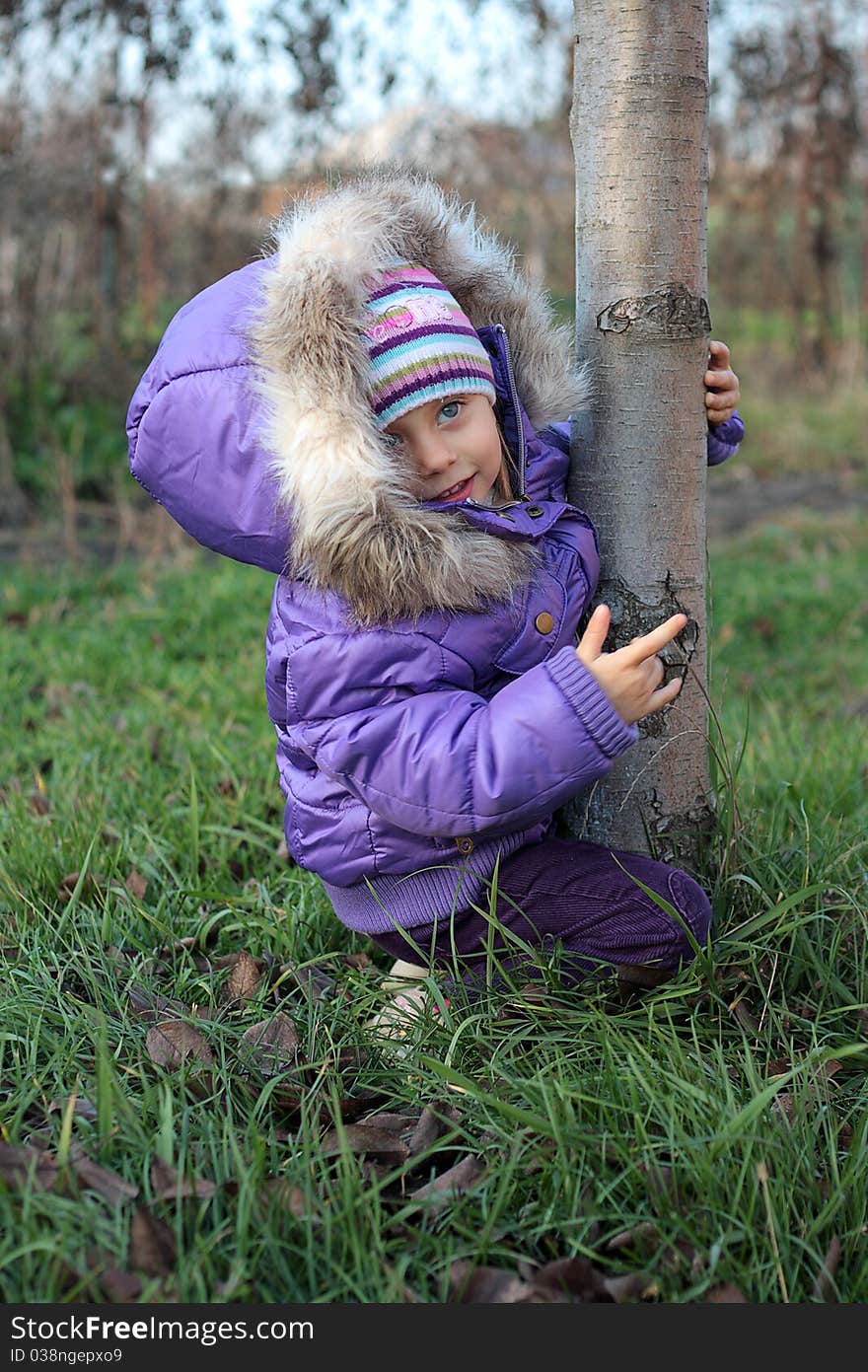 Beautiful little girl laughing outdoors