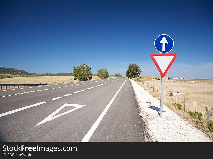 Give way red signal in a highway at Cadiz Spain. Give way red signal in a highway at Cadiz Spain