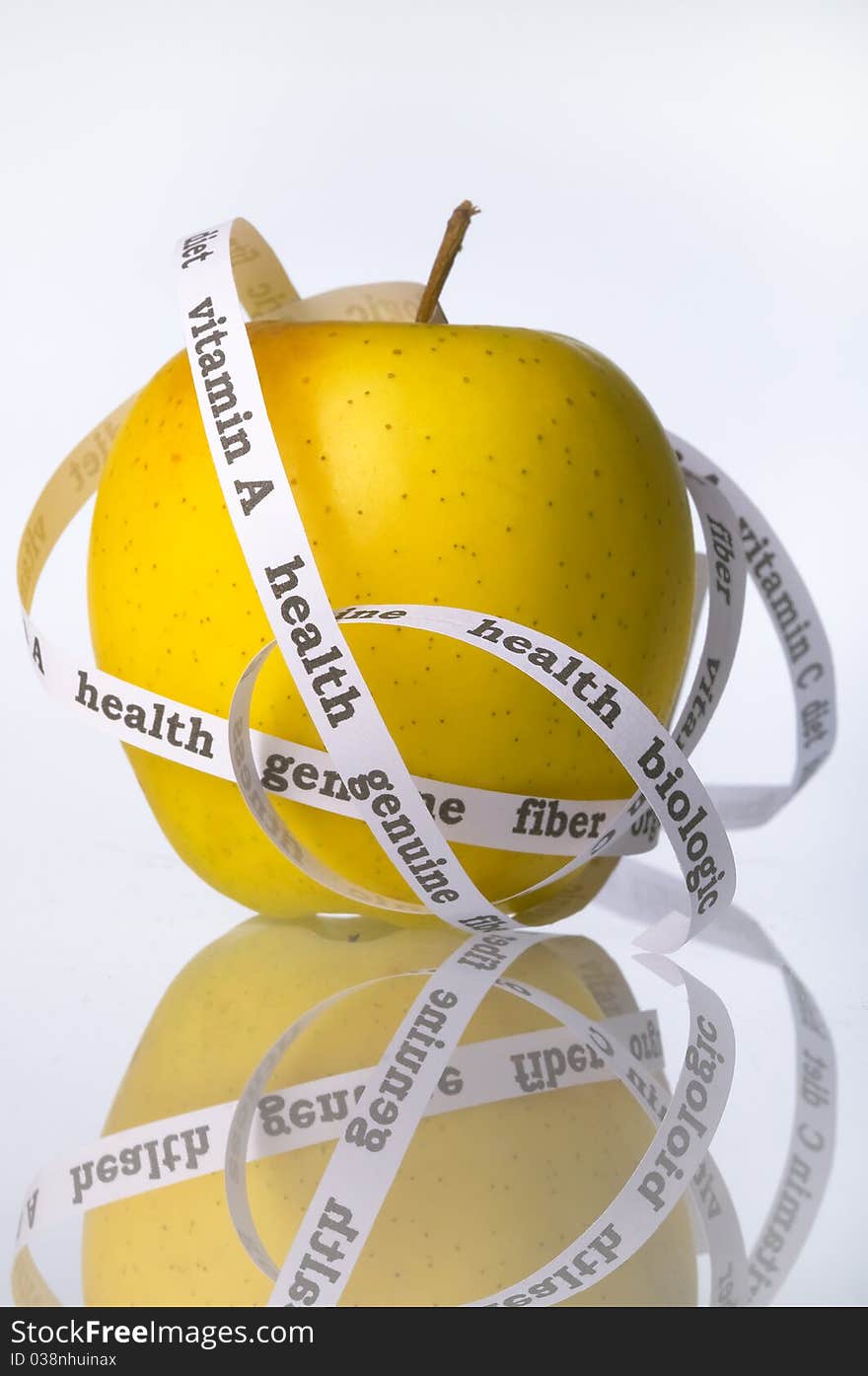 Biologic yellow apple surrounded by words