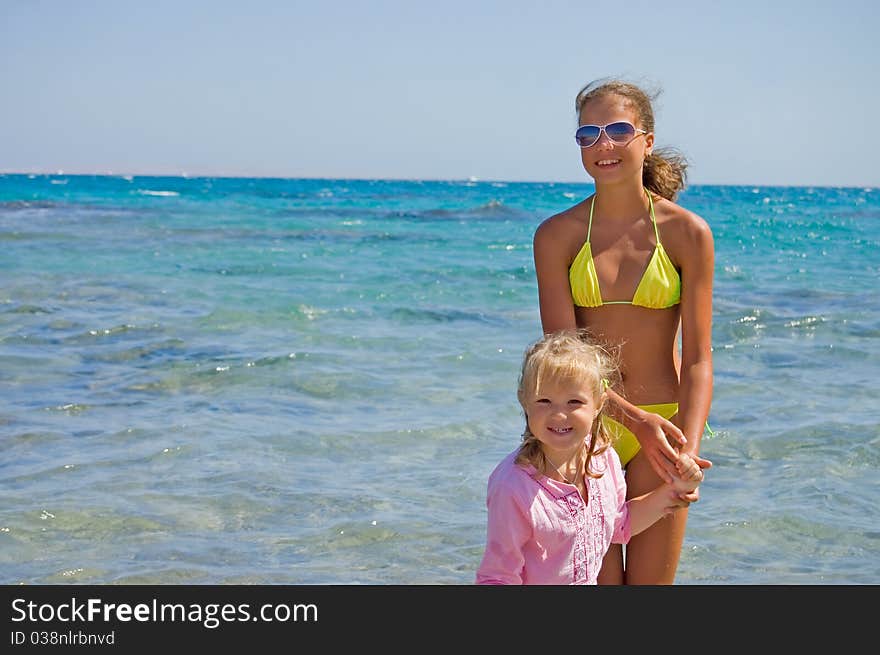 Two girls at the sea. Two girls at the sea