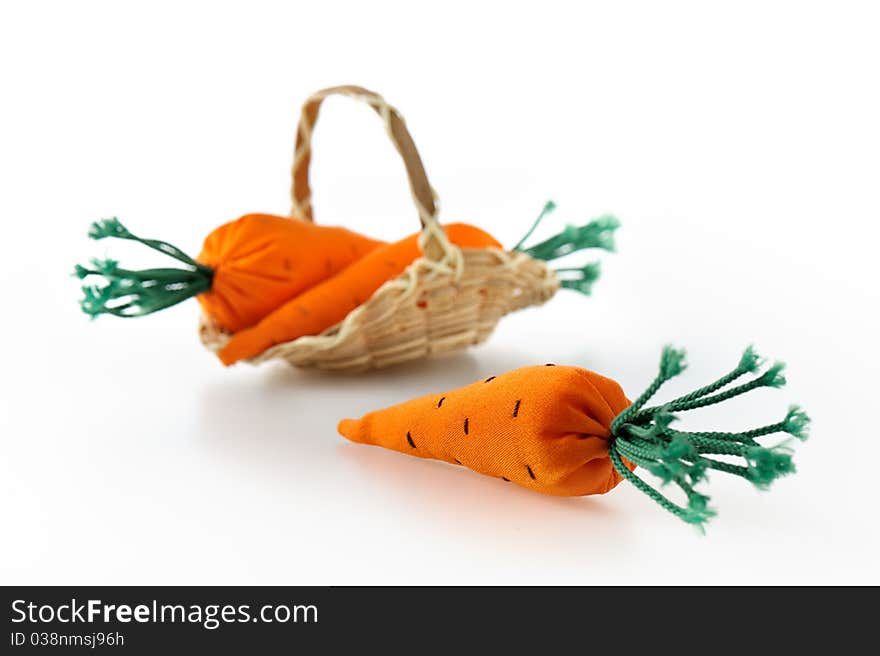 Toy carrot from fabric on white background. Toy carrot from fabric on white background