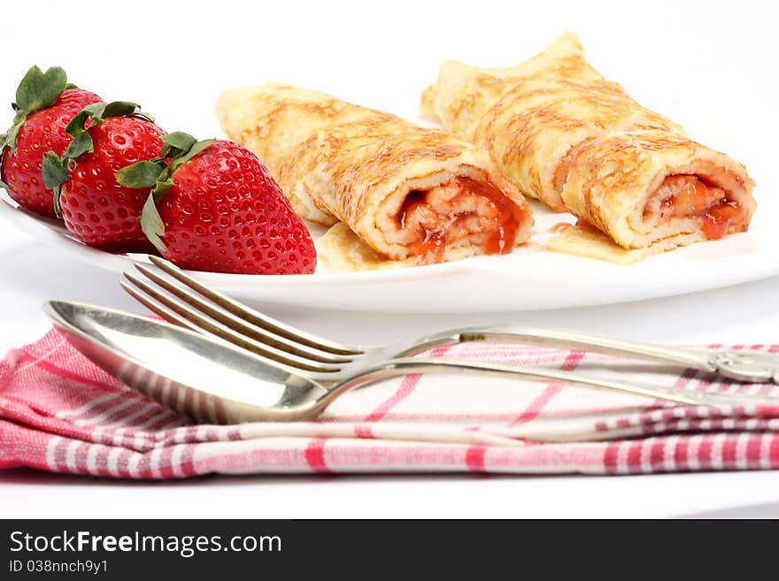 Pancakes with cream and strawberry