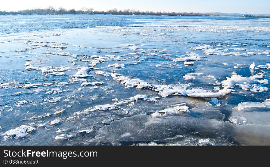 big chunk of ice on frozen river