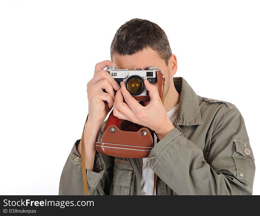 Young professional photographer with old retro film camera. isolated on white background