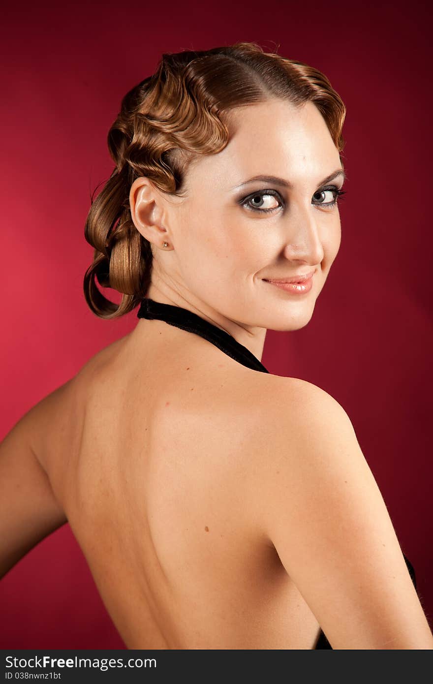 Nude back of elegant smiling female