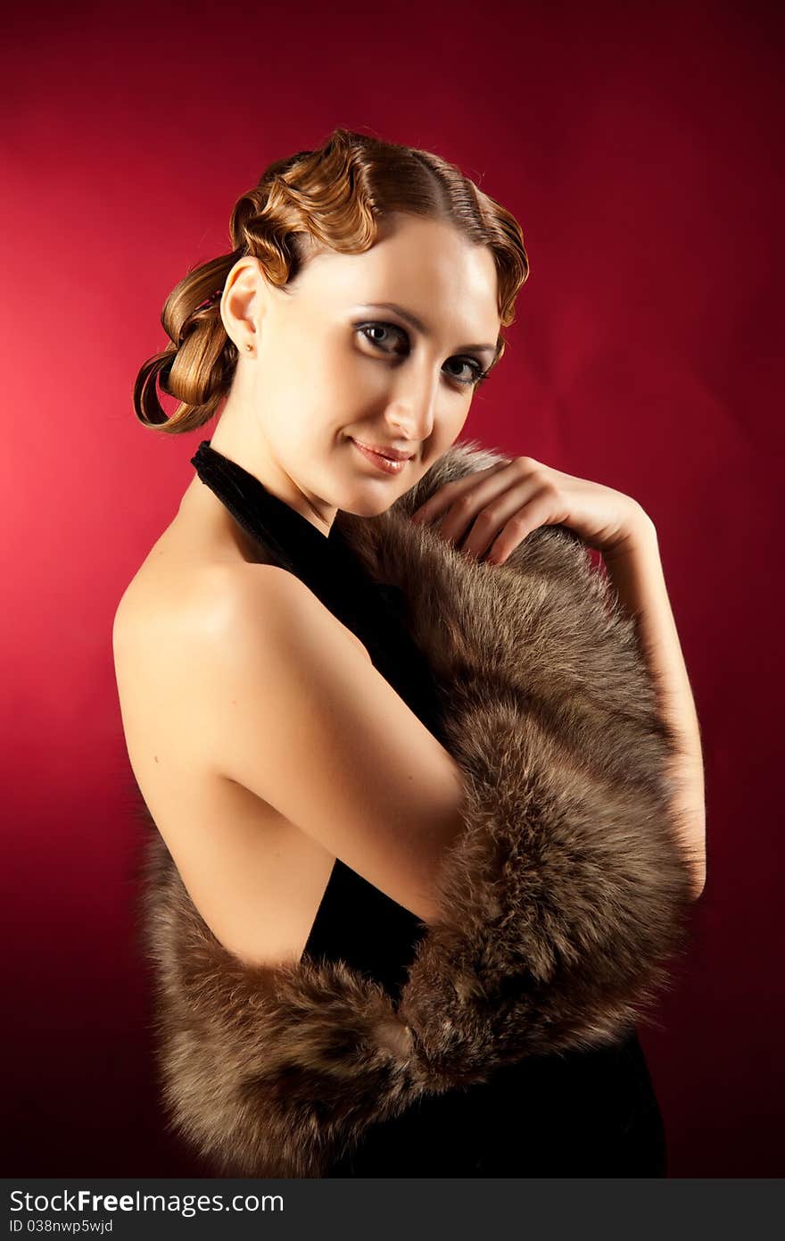 Shot of elegant woman in classic style with fur. Shot of elegant woman in classic style with fur