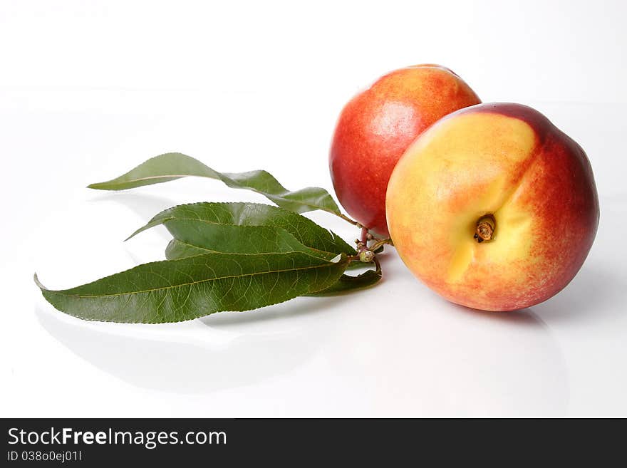 Colorful peaches isolated on white background