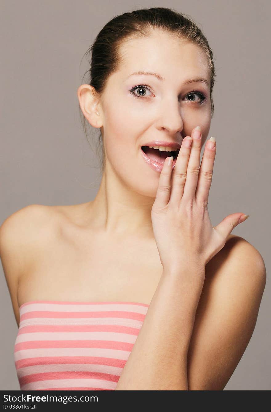 A beautiful young girl with a surprised look