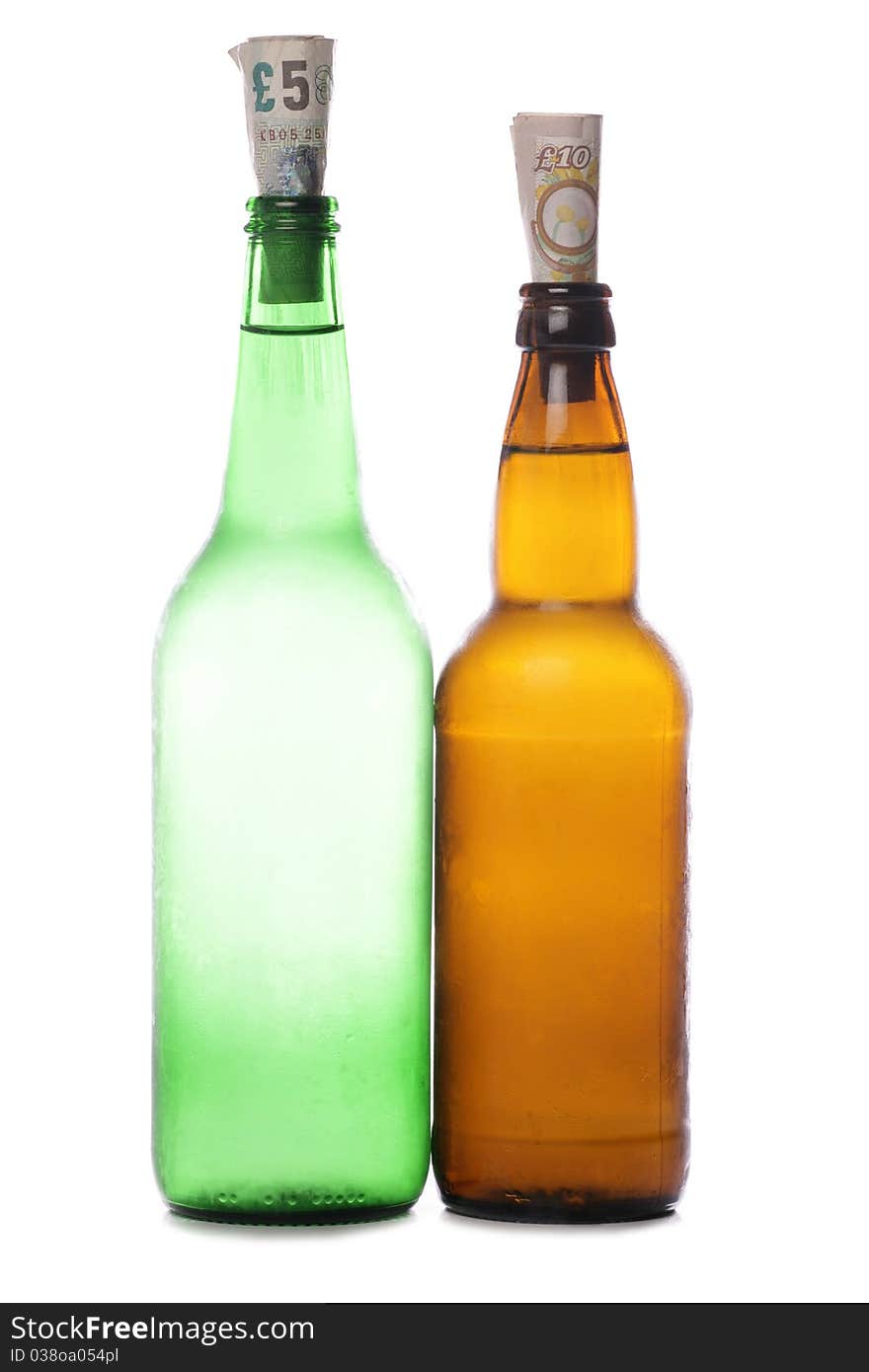 Beer and cider bottles with sterling money