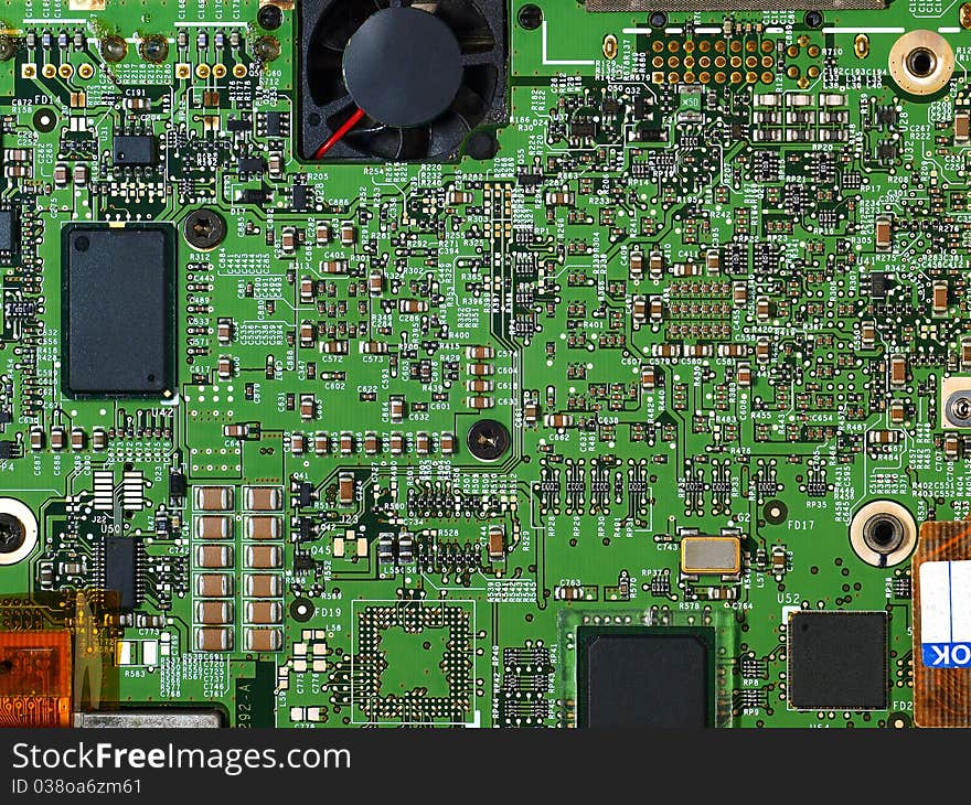 Detailed image of computer motherboard and integrated circuits. Detailed image of computer motherboard and integrated circuits.