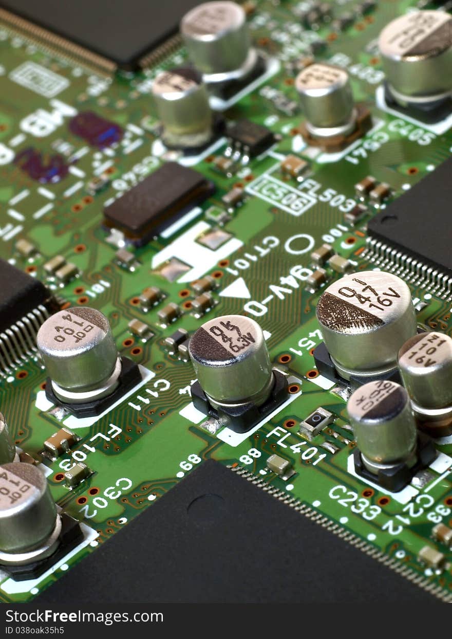 Detailed image of computer motherboard and integrated circuits. Detailed image of computer motherboard and integrated circuits.