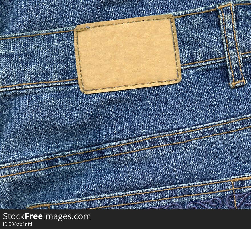 Blank leather label on blue jeans. Blank leather label on blue jeans