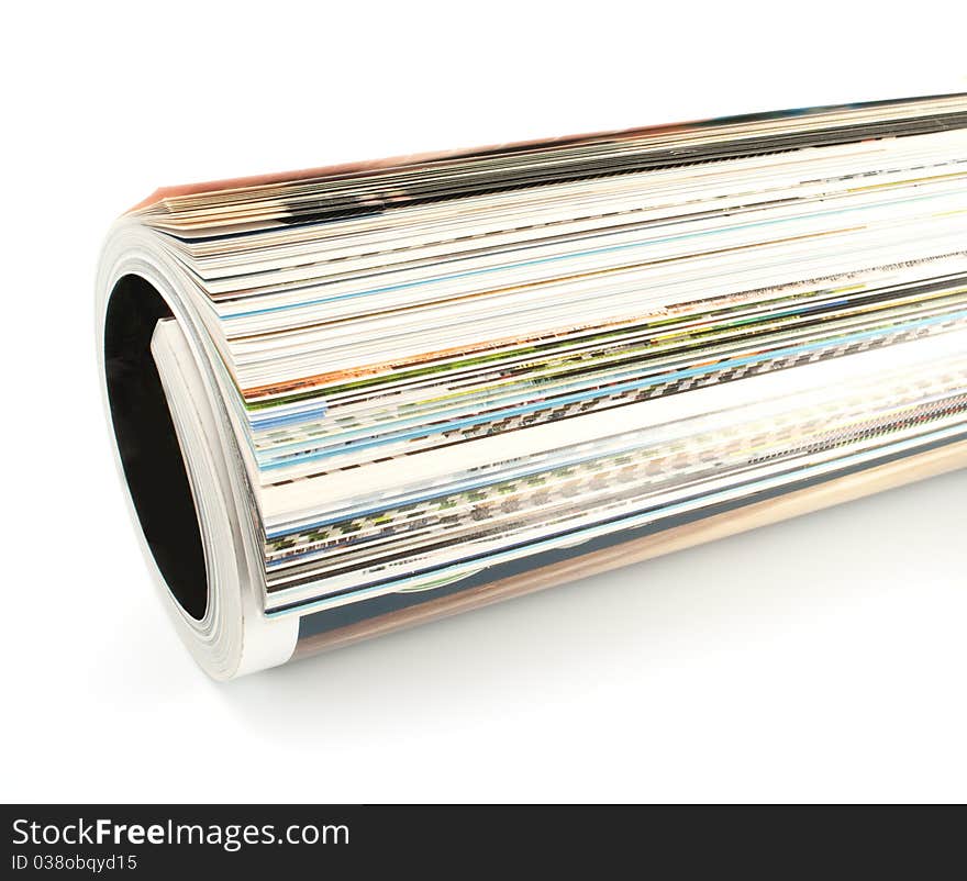 Rolled up magazine isolated on white background. Rolled up magazine isolated on white background