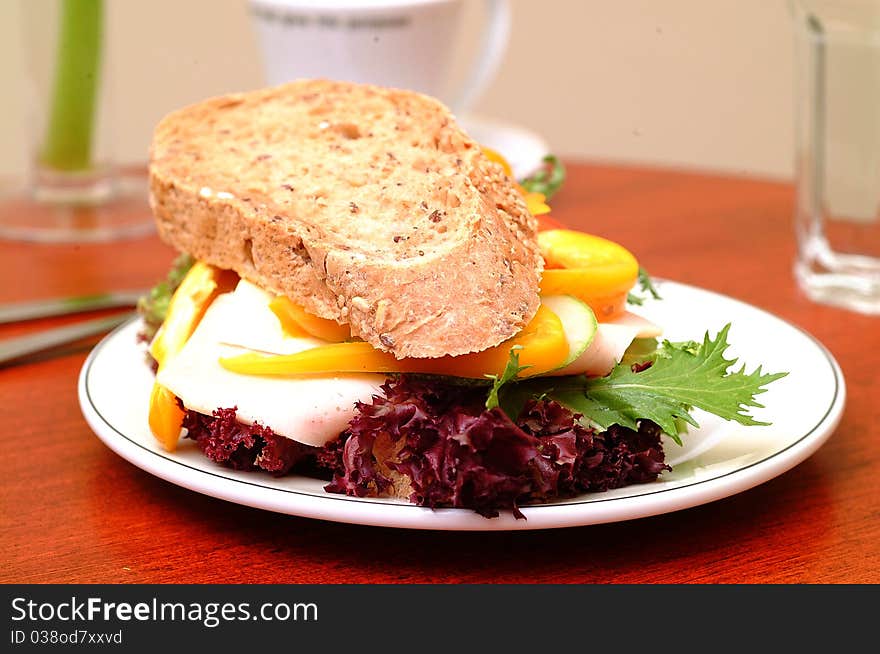 Ham sandwich with red pepper and leaf lettuce