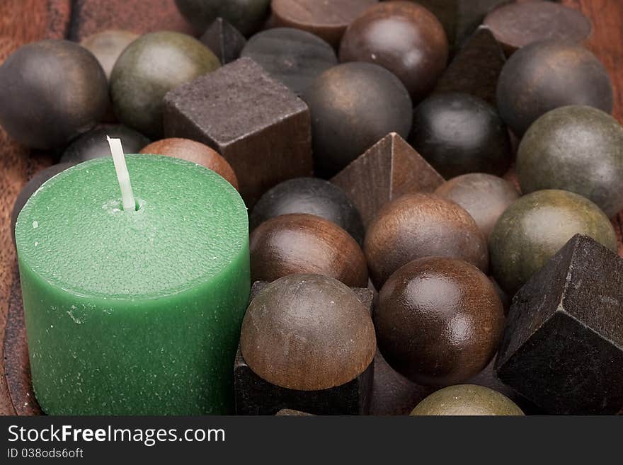 Scented candle and a set of decorative objects made of aromatic wood. Scented candle and a set of decorative objects made of aromatic wood.