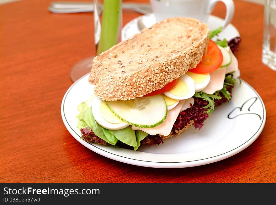 Ham sandwich with red pepper and leaf lettuce