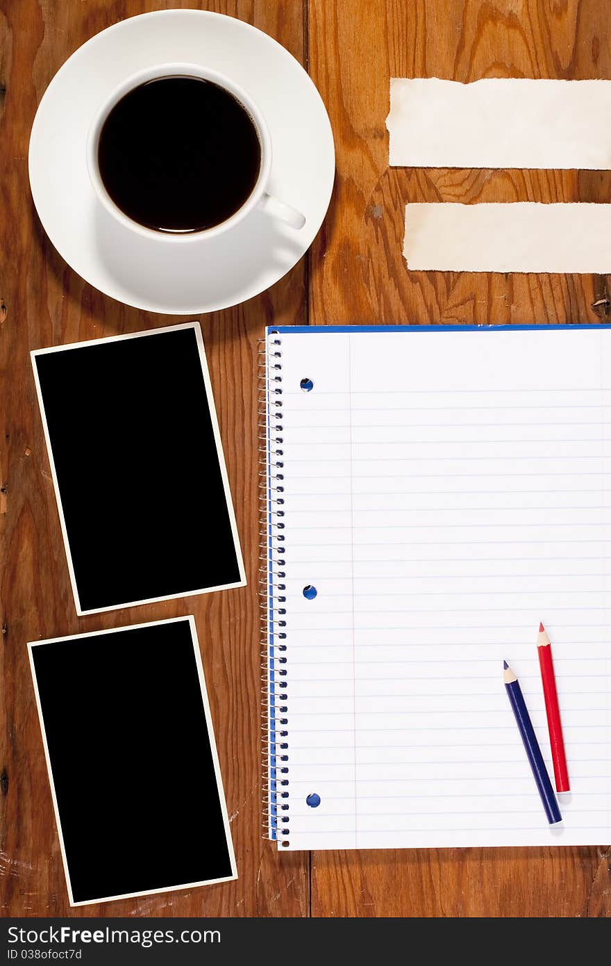 Notebook and Information clean sheets on the old wooden background.