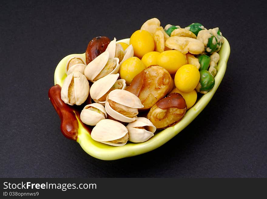 Assortment of asian nuts on jug