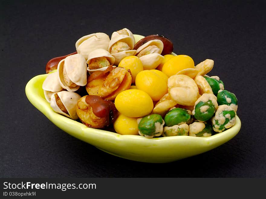 Assortment of asian nuts on jug