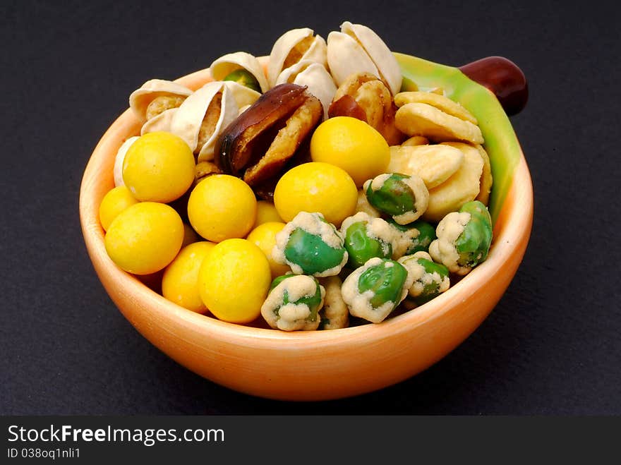 Assortment of asian nuts on jug