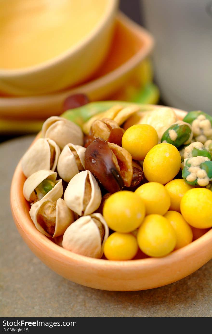 Assortment of asian nuts on jug