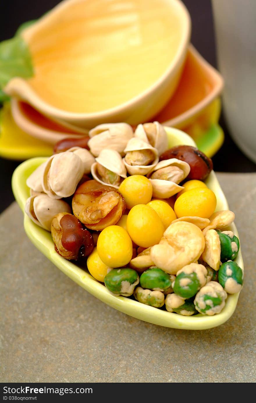 Assortment of asian nuts on jug