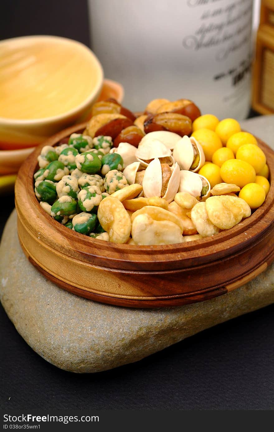 Assortment of asian nuts on jug