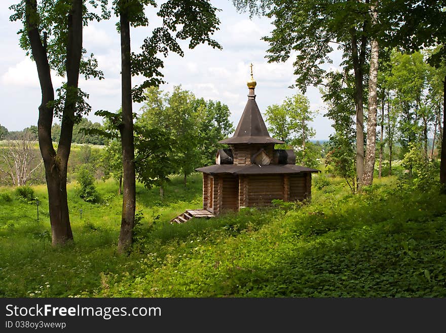 The wooden orthodox church in the forest