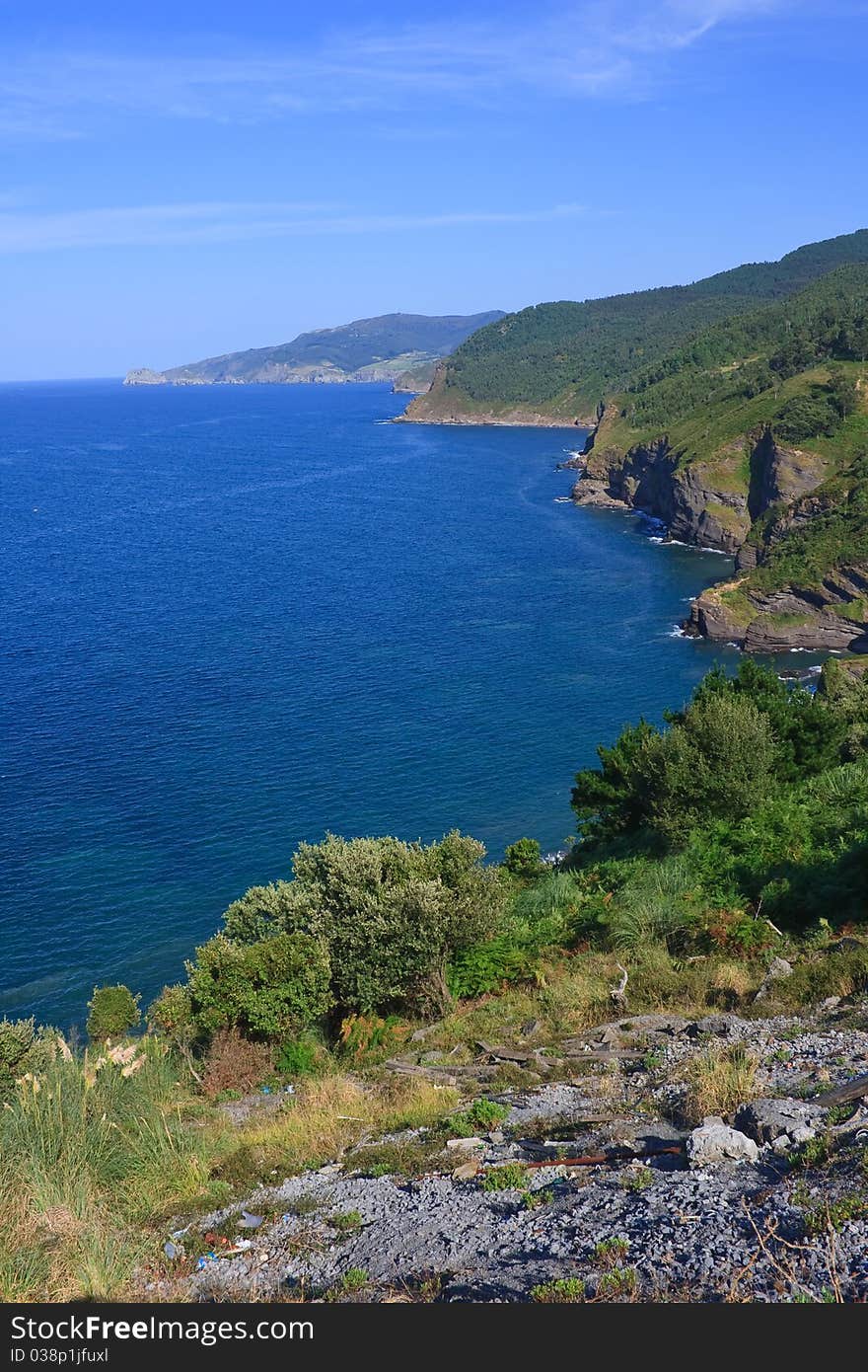 Beautiful view of the green basque coastline in a sunny day. Northern Spain. Beautiful view of the green basque coastline in a sunny day. Northern Spain.