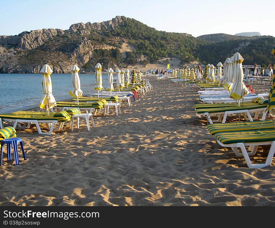 Beach With Beds And Umbrellas