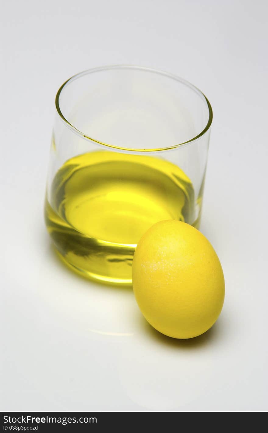 Yellow dye and yellow Easter egg. Yellow dye and yellow Easter egg