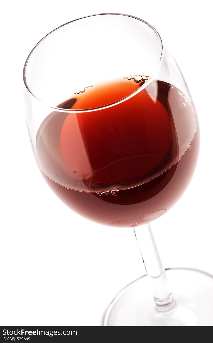 Glass with red wine on white. Glass with red wine on white