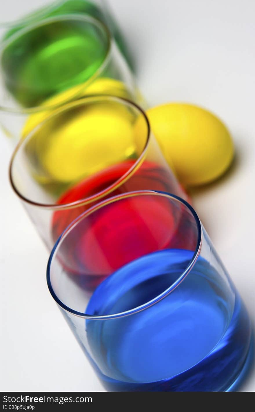 Blue, red, yellow and green dye with Easter egg. Blue, red, yellow and green dye with Easter egg