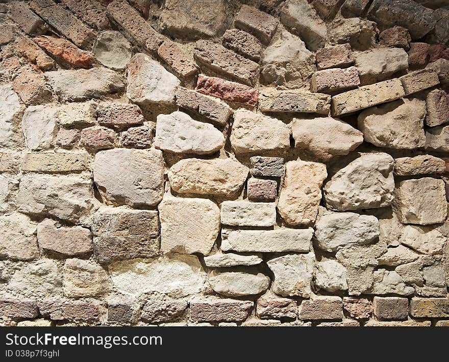 Brick and stone wall texture with messy structure. Brick and stone wall texture with messy structure