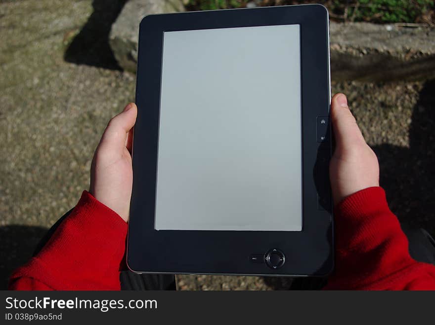 People with two hands holding the e-book