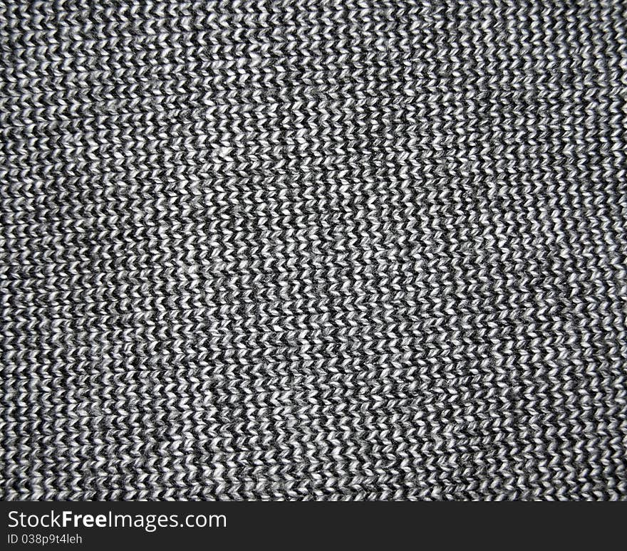 Background made of a knitted dark clothing. Background made of a knitted dark clothing.