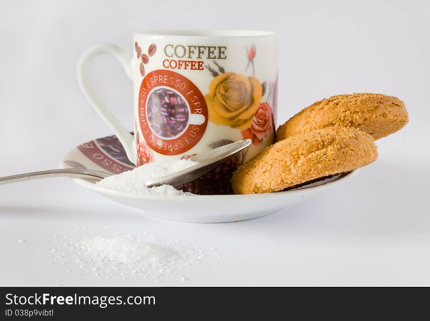 Coffee cup with teaspoon and cookies on white background. Coffee cup with teaspoon and cookies on white background